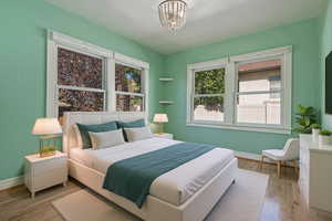 Bedroom featuring baseboards and light wood-style floors