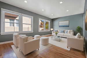 Living room featuring recessed lighting and light wood-type flooring