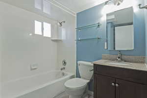 Full bathroom with vanity and bathing tub / shower combination