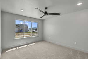 Unfurnished room with carpet, recessed lighting, and a ceiling fan