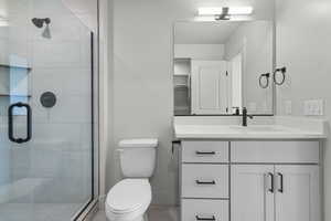 Bathroom with vanity and a stall shower