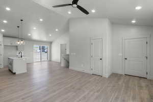 Unfurnished living room featuring recessed lighting, light wood-style floors, high vaulted ceiling, and a ceiling fan