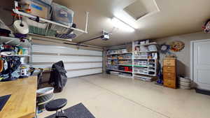 Garage featuring a garage door opener