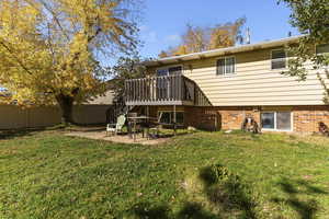 Rear view of house with a patio area, a deck, and stairway