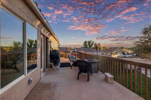View of patio featuring a fire pit and a grill
