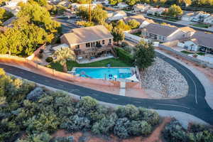 Aerial perspective of suburban area with a pool