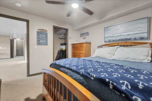 Bedroom with carpet flooring and a ceiling fan