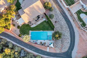 View of subject property with a pool
