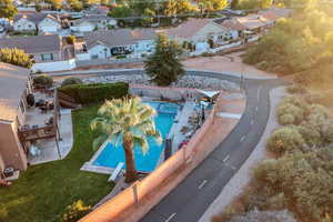 Aerial perspective of suburban area featuring a pool area