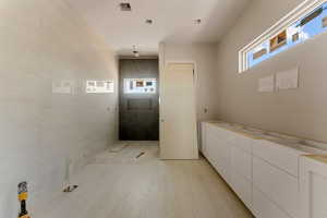 Full bathroom featuring a tile shower