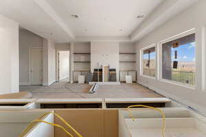 Unfurnished living room with visible vents and baseboards