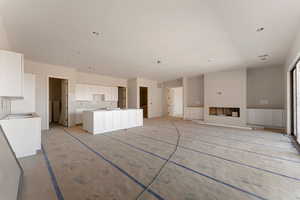 Unfurnished living room featuring visible vents