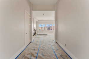 Hall featuring baseboards