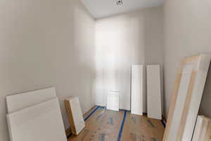 Unfurnished room featuring visible vents