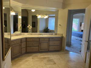 Primary Ensuite bathroom featuring double vanity