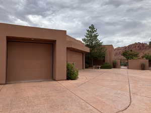 View of side of property with 3 car garage with Mountain View