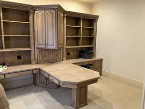 Office area featuring built in desk