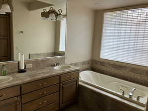 Casita Bathroom suite with a garden tub and double vanity. Also has walk-in shower