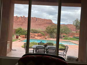 View of patio featuring Red Rock mountain views and outdoor dining area