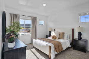 Bedroom featuring carpet floors and baseboards