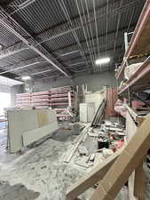 Miscellaneous room featuring unfinished concrete flooring