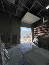 Miscellaneous room featuring a garage and a heating unit