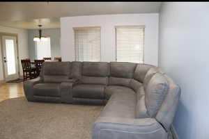Living room with suspended lighting