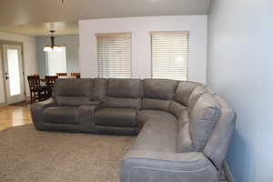 Living area with baseboards and wood finished floors