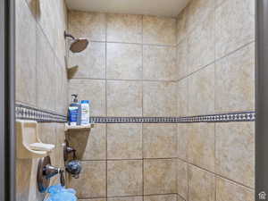 Details with a tile shower