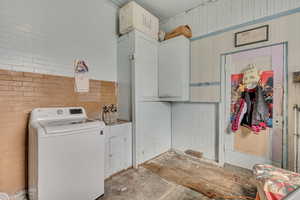 Laundry area with washer