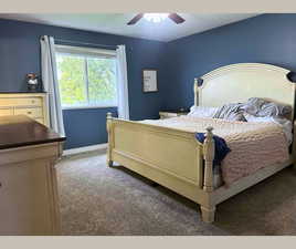 Bedroom featuring carpet floors and a ceiling fan