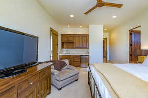 Bedroom with recessed lighting, light colored carpet, and a ceiling fan