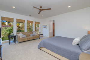Carpeted bedroom featuring recessed lighting and a ceiling fan