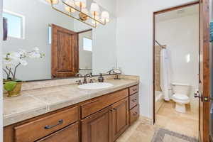 Bathroom with vanity and shower / bath combo