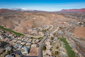 Aerial overview of property's location featuring mountains and nearby suburban area