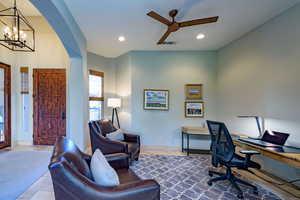 Office area featuring recessed lighting, a chandelier, a ceiling fan, and arched walkways