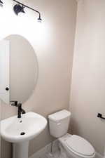 Bathroom featuring toilet and tile patterned floors