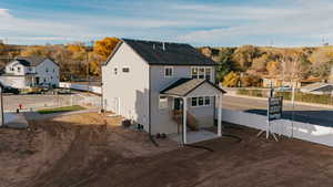 Rear view of house featuring a residential view