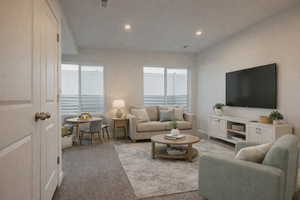 Carpeted living room featuring recessed lighting and baseboards