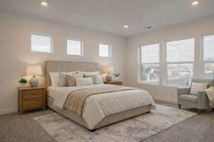 Carpeted bedroom with recessed lighting and baseboards