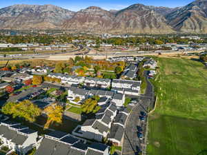Aerial view of property's location with a mountainous background and nearby suburban area