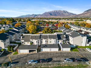 Aerial view of residential area featuring a mountain backdrop