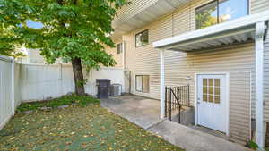 Fenced backyard with a patio