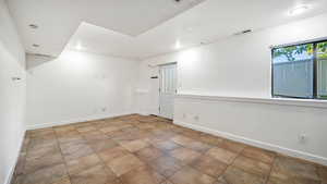 Spare room featuring baseboards