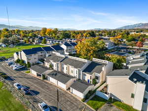 Aerial view of residential area featuring a mountainous background