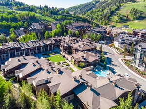 Bird's eye view of a mountainous background and a pool area