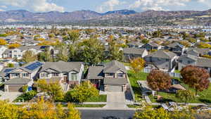Aerial view of residential area featuring mountains