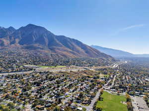 Aerial perspective of suburban area with a mountainous background