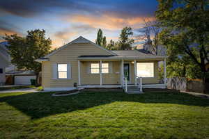 Bungalow-style house featuring a porch and a chimney