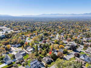 Aerial view of property's location with nearby suburban area and a mountain backdrop